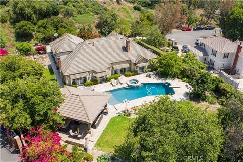 Experience luxury in the exquisite community of Hidden Hills, Yorba Linda. This Gem features 5 bedrooms and 3 bathrooms secluded at the end of the cul-de-sac complemented by an extensive driveway privately tucked away boasting 4,001 sqft of luxury on...
