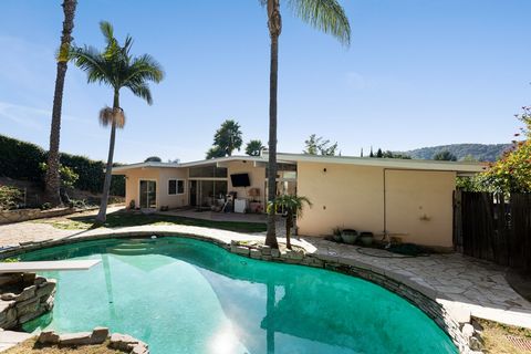 Step into a captivating mid-century gem nestled in a serene neighborhood, offering four bedrooms and three bathrooms spread across a generous 2,612 square feet. On the market for the first time in thirty years, this home beautifully captures the esse...