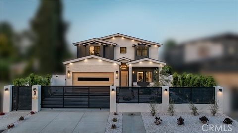 Nestled in the prestigious community of Tarzana, this securely gated home offers five bedrooms and five-and-a-half bathrooms. The interior boasts exquisite paneling walls, including custom white oak millwork and panels. The first floor features a dec...