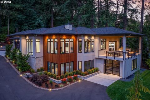 This show-stopping custom-built Pacific Northwest Contemporary home by award-winning Teal Point Construction was crafted as the builder's personal residence, showcasing unmatched craftsmanship and construction quality. Nestled among tall trees on a b...