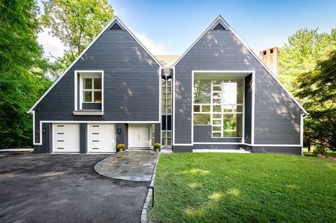 Welcome to this sun-drenched modern home, meticulously and newly renovated, nestled in the prestigious Wampus Lakes Estates just moments from downtown Armonk. This contemporary masterpiece boasts an open floor plan that seamlessly blends modern elega...