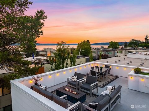 VIEWS & privacy! Tucked away with a secluded backyard & stunning rooftop deck, this luxurious sanctuary offers expansive views of Lake Washington, Cascades, & downtown Seattle. 4 bedrooms, 3.25 baths, 2-car garage, & custom finishes thru-out. The ope...