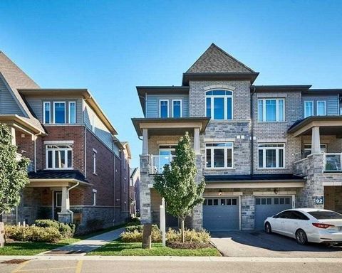 Welcome To This Executive 2 Bedroom End Unit Townhome That Feels Like A Semi, Located In The Desirable Duffin Heights Community. With Premium Laminate Flooring Throughout All Levels, Custom Window Covering, Private Balcony To Enjoy Your Morning Coffe...