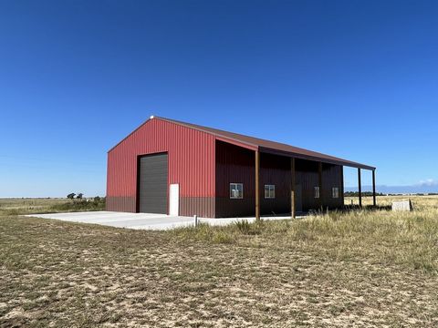 With this 40-acre property's 60x40 custom shop/barn and other improvements, the sellers have provided a new owner with a significant head start in developing a rural residence, business, farm, or horse property.Located just 10 miles from Calhan or Fa...