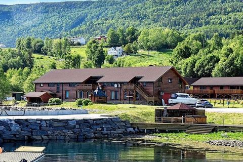 Luxury holidays with swimming pool, directly by the fjord surrounded by a fantastic fjord and mountain landscape. Great holiday apartment, living room with leather sofa, sound system, and large TV with many TV channels. High quality kitchen: Cooling ...