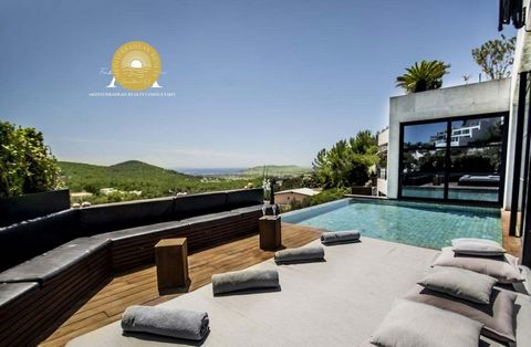 Contemporary style Luxury Vlla with Tourist License and sea view. This impressive, contemporary, luxury villa is located in the peaceful hillside of ultra exclusive Can Furnet, an area protected by 24 hour security for the utmost tranquility of the g...