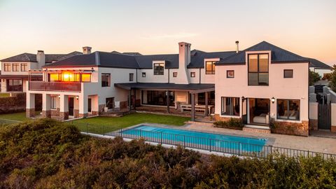 Located in one of the most sought-after areas within a world-class golf estate, this property offers panoramic views of the Atlantic Ocean, the iconic Table Mountain, and Robben Island. Atlantic Beach Golf Estate provides an unparalleled lifestyle wi...