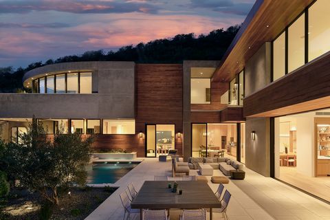 Located on almost an acre in prime Bel Air surrounded by mature Pepper trees and lush California landscaping, this beautifully curated and newly constructed estate showcases the finest contemporary architecture, bespoke interiors by KNA Design and tr...
