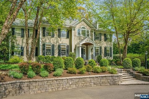 Live life where every day feels like a vacation getaway. Set on nearly one flat acre in the heart of Short Hills, this resort-style property blends effortless luxury with relaxed indoor-outdoor living. Lounge beside the in-ground pool with its tranqu...