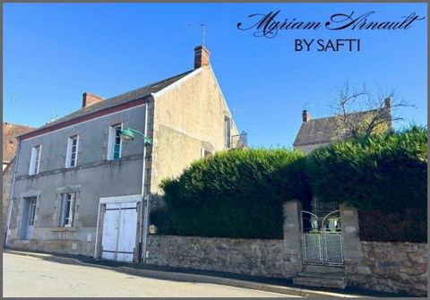 Maison divisée en 2 appartements avec garage et jardin