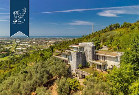 Framed by the majestic Apuan Alps and the renowned Versilian Coast, this spectacular estate for sale was designed by great Florentine architect Paolo Piazzesi. Built in the 1970s on top of a hill overlooking the center of Camaiore, this property is t...