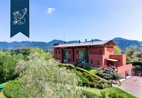 This modern luxury estate for sale composed of two exclusive, recently-built panoramic villas overlooks Monfumo's stunning hills, just a few kilometres from Asolo, surrounded by an idyllic landscape made of rows of vines, olive trees and apple t...
