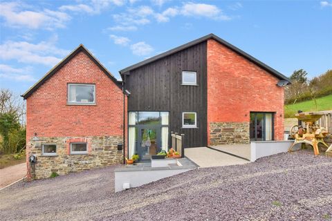 Located along a quiet no through lane, with lovely countryside views on the outskirts of the popular village location of Swimbridge, is this spacious and executive 5 double bedroom semi-detached barn conversion. Having been converted within the last ...