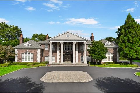 Welcome to 3 Tatem Way, where a palatial entrance framed by towering columns sets the stage for an unparalleled life of luxury. Nestled within a prestigious private gated community in Old Westbury and sprawled across over 4 acres, this grand estate o...