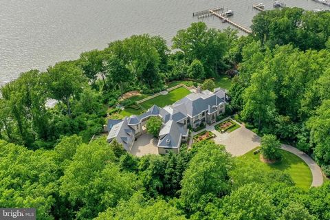 This remarkable, gated 20-acre waterfront estate with its French inspired main residence, is nestled high on the banks of the Severn River, just minutes from downtown Annapolis and less than an hour from Washington, DC. Enjoy coveted western exposure...