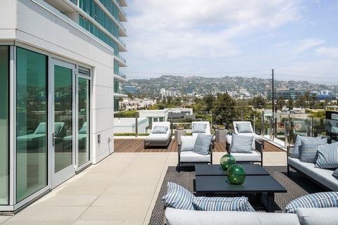 FINAL PHASE NOW RELEASED! RESIDENCE 209 (aka 2N) OF THE FOUR SEASONS PRIVATE RESIDENCES LA: A spectacular two-story, 2-bedroom townhome with a private elevator and spacious approx 729 SF rooftop terrace. Towering above its neighbors and set in a cove...