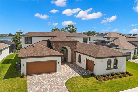 One or more photo(s) has been virtually staged. Immerse yourself in the epitome of luxury living in this exquisite five-bedroom, four-bathroom home, nestled within the gates of the prestigious 80-lot community. Curb appeal, paved drive and walkway pr...