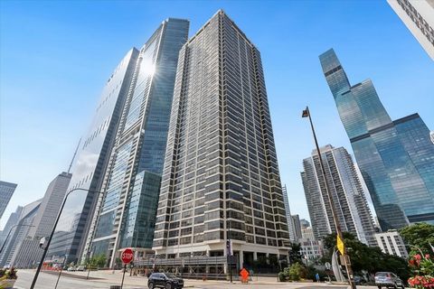 Elevated on the 31st floor of a sought-after downtown building, this sophisticated 1 Bedroom, 1.1 Bath condo spans over 1,000 square feet of luxurious urban living space. Its grand double-width entry leads to an open floor plan with tall windows offe...