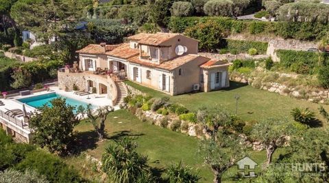 Located several minutes drive from Cannes, in a sought-after gated community, this charming Provencal-style property offers stunning panoramic views over the surrounding hills and the sea. The house is built on a plot of around 2390m2 with a large po...