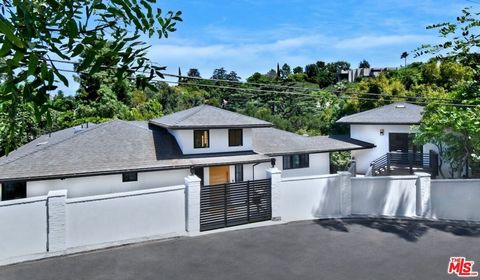 Welcome to this walled and gated retreat, nestled on a tranquil street in the serene foothills of Sherman Oaks. Recently completed in 2024, this renovation showcases stunning interiors with views, high ceilings, custom lighting, white oak hardwood fl...