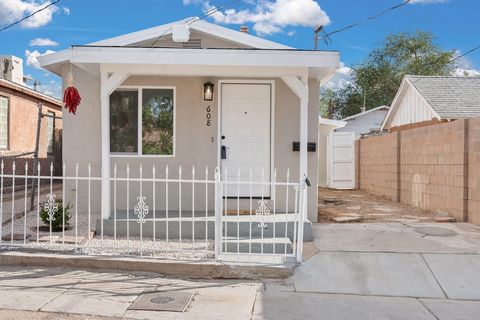 Discover this charming adobe home in the historic Martinez Town neighborhood of Albuquerque, New Mexico. This beautiful residence seamlessly blends traditional Southwestern architecture with modern finishes. Enjoy freshly textured walls, new light fi...