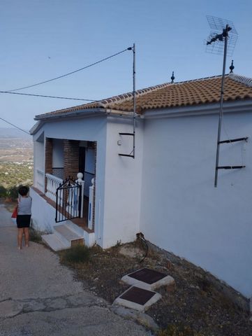 Cozy country house with 7000m² of land. The house has 60m² distributed in 2 bedrooms, bathroom and kitchen open to the living-dining room. It is very bright and from its terrace you can enjoy impressive views of the beautiful Axarquía of Malaga. It a...