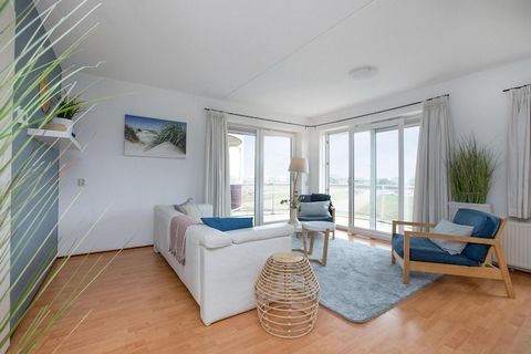 Welcome to a beautifully modern furnished apartment that comfortably accommodates up to four guests. Located on the first floor, this delightful retreat features a balcony where you can enjoy stunning views of the dunes. The living room is warmly dec...