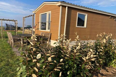 This charming holiday home offers a peaceful retreat for up to four guests. With its proximity to the scenic IJsselmeer Lake and lush forests, it’s perfect for nature lovers and relaxation seekers. Whether you're looking to unwind in the private gard...