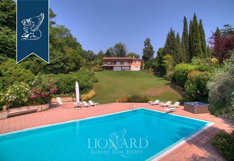 This villa for sale in lake-front position is located in Manerba del Garda. The villa measures 700 m2, it features big bright rooms that can meet any kind of need. This property is divided into two independent apartments, one on the ground floor and ...