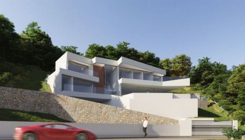 This beautiful new construction project with license is located in Altea Hills and offers beautiful views over the countryside and the sea The villa is spread over 2 floors and offers a spacious open plan lounge with dining area a laundry room a toil...