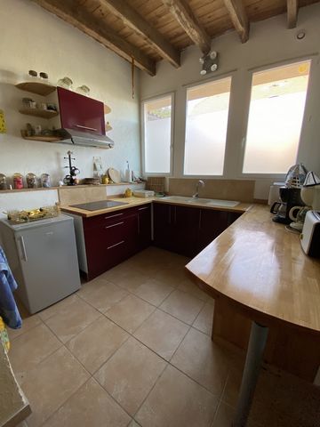 Pretty stone village house sold furnished. It is on 2 levels, with a small garden, and 1 outdoor parking space. On the ground floor, the kitchen is open to the living room, heated with a pellet stove. In the room, a technical room including the water...