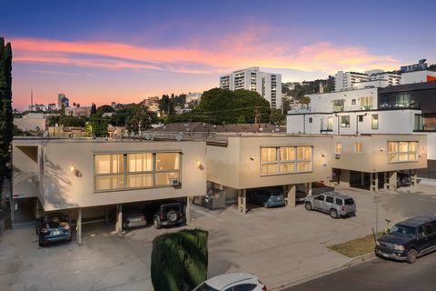 A 7 unit building, with a mix of studio, one-bedroom, two-bedroom, and three-bedroom residences. 1015 is sold together as a package with the two adjacent lots (1005 N Croft Ave. and 1009 N Croft Ave.) Buyers can carry out an extensive remodel or simp...