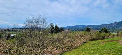 Extraordinary lot with mountain, bay and ocean views. Ready for your new home. Septic feasibility is complete, power and water are at the property line. The bottom of the lot has a beautiful stand of Douglas Fir trees with under growth. This property...