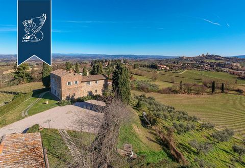This elegant farmstead for sale stands on top of a hill surrounded by countryside in the province of Siena. This 19th-century property is surrounded by a garden measuring 6,000 sqm with a panoramic swimming pool, a vineyard and an olive grove, and is...