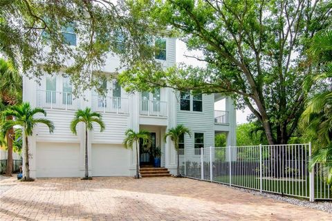 Welcome home to your luxurious Key West style home in the highly desired Sunset Park with water views! As you walk into this stunning three-story home, you are greeted with elegance, light, and lush vegetation outside of every window. The first floor...
