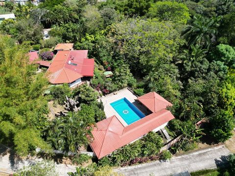 For sale in Carrillos, Alajuela, on the road to Tacares, Grecia, is a serene countryside home surrounded by lush greenery. The property spans 11,600 square meters (2.9 acres) facing the main road, with a total construction area of 611 square meters (...