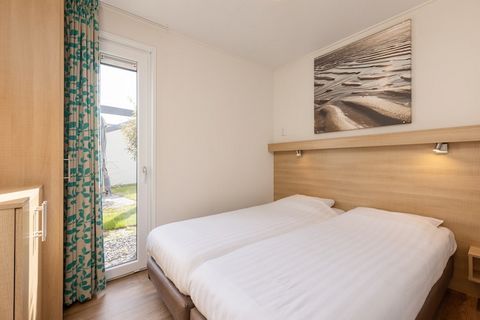 Coastal Comfort with Modern Flair Enjoy the tranquility of the Dutch coast in this beautifully designed holiday home, perfect for families or friends—plus your furry companions! This modern bungalow features an open-concept living area with a Smart T...