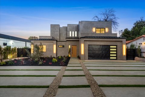 This stunning new construction home is located in the heart of one of Tarzana's most desirable neighborhoods - Melody Acres. This privately gated abode showcases masterful design, boasting an open floor plan with extraordinary indoor-outdoor flow, in...