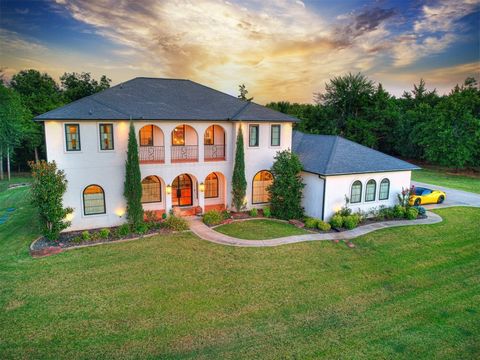 An exceptional Santa Barbara-inspired estate in the gated community of Fountain Gate Estates in East Edmond, Oklahoma. This home offers a rare blend of elegance, modern design, & superior craftsmanship. Step through the grand entryway and discover an...