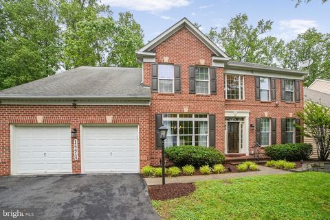 Welcome home to this gorgeous 3-level brick front colonial with an impressive cathedral-style foyer. Drenched in natural sunlight, this home offers several impressive upgrades, including architectural columns, crown moldings and sparkling hardwood fl...
