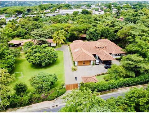 Imagine arriving at this magnificent luxury home in Santana, Costa Rica. As you enter through the main gate, you are greeted by a beautiful landscaping full of fruit trees and a little nursery. The property is located in Santa Ana, one of the best pl...