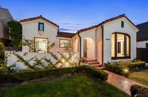On a tree-lined street within coveted Carthay Square sits a tastefully revived 1920's Spanish beauty. Tall hedges and a gated driveway help lend to the privacy of the home. Behind the gates you have room for up to four cars. As you step into the entr...