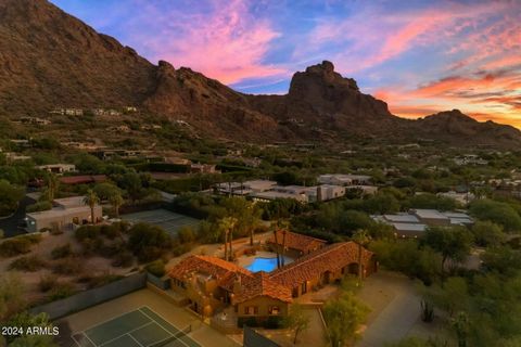 Welcome to Your Dream Retreat in Paradise Valley! This exquisite home offers stunning views of Camelback Mountain, nestled next to The Sanctuary resort. Spanning over 3,000 sq ft, this property features multiple casitas, providing ample space for fam...