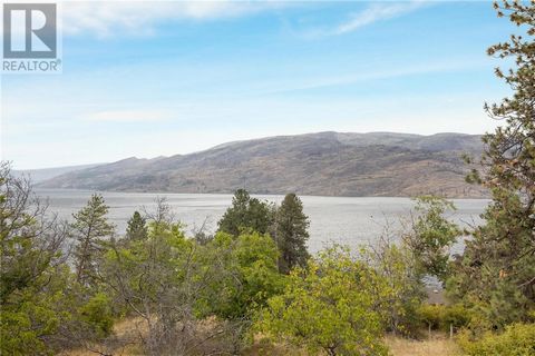 DEVELOPERS - Plans in place for 24-30 unit townhouse project. Ability to subdivide off the house and build 24-30 townhouses. 2.84 acre property with stunning views of Lake Okanagan. Minutes to downtown Peachland, beach, shops, restaurants, boat launc...