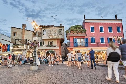 Welcome to your home away from home in the charming coastal town of Caorle, Italy! Nestled in a serene setting just a short stroll away from the sun-drenched shores of the Adriatic Sea, this delightful apartment offers the perfect blend of comfort, c...