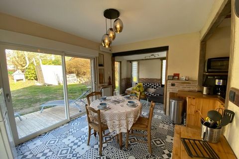 Charming, tastefully renovated holiday home nestled in a peaceful, bucolic setting in the heart of a small village overlooking the lively seaside resort of Granville. The bright living room with dining area opens through large bay windows onto two so...