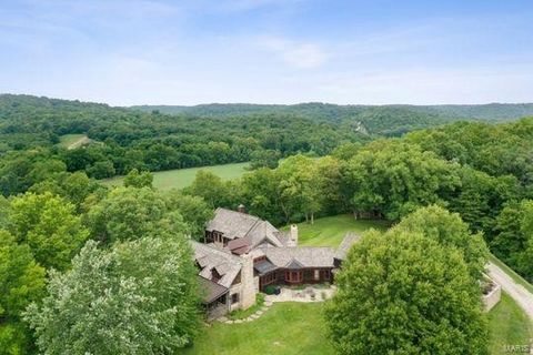 Situated on approx. 39 acres, this private retreat with 360-degree views, will take your breath away. This stunning estate is one of a kind with a list of special features that are sure to impress. At the core, a log cabin was reconstructed on the pr...