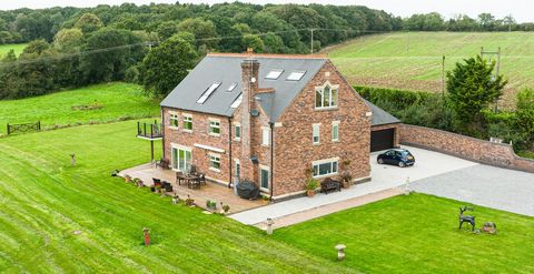 Accessed via a picturesque driveway bordered by open fields and hedgerows, Ladywood Farm showcases premium features including porcelain floors, high ceilings, and contemporary doors. The study, adjacent to the entrance, connects to the double garage....