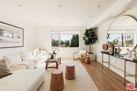 Surrounded by the best that West Hollywood has to offer between Melrose Ave and Santa Monica Blvd sits this beautiful modern townhouse. Through the front door, a long hallway leads past two guest bedrooms with a jack and jill bathroom to a staircase....
