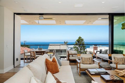 PROTECTED OCEAN VIEWS and exceptional upgrades fill this custom-built modern residence set just a few blocks from the ocean. Thoughtfully redesigned by Kate Lester Designs and featuring quality touches of high ceilings, glass walls, white oak hardwoo...